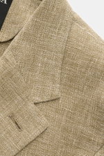 Close-up front-side view of Zegna Smart-casual jacket olive mottled showing step lapel and fine textured linen, wool, and silk blend fabric.

<p>Hot days are guaranteed to be enjoyable in this smart-casual jacket in linen, wool and silk with distinctive m