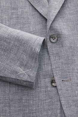 Close-up view of the Zegna Smart-casual jacket 'Riviera' dark navy/white mottled showing the fine weave, buttons, and sleeve cuff details.

Description: <p>The smart-casual jacket 'Riviera' by ZEGNA made of linen and wool with silk content has a comfortab