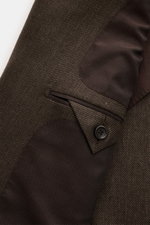 Close-up side view of the Zegna Smart-casual jacket dark brown showing the textured cashmere, silk, linen blend fabric with a buttoned cuff and flap pocket detail.

Description: <p>The two-button smart-casual jacket by ZEGNA made of cashmere and silk with