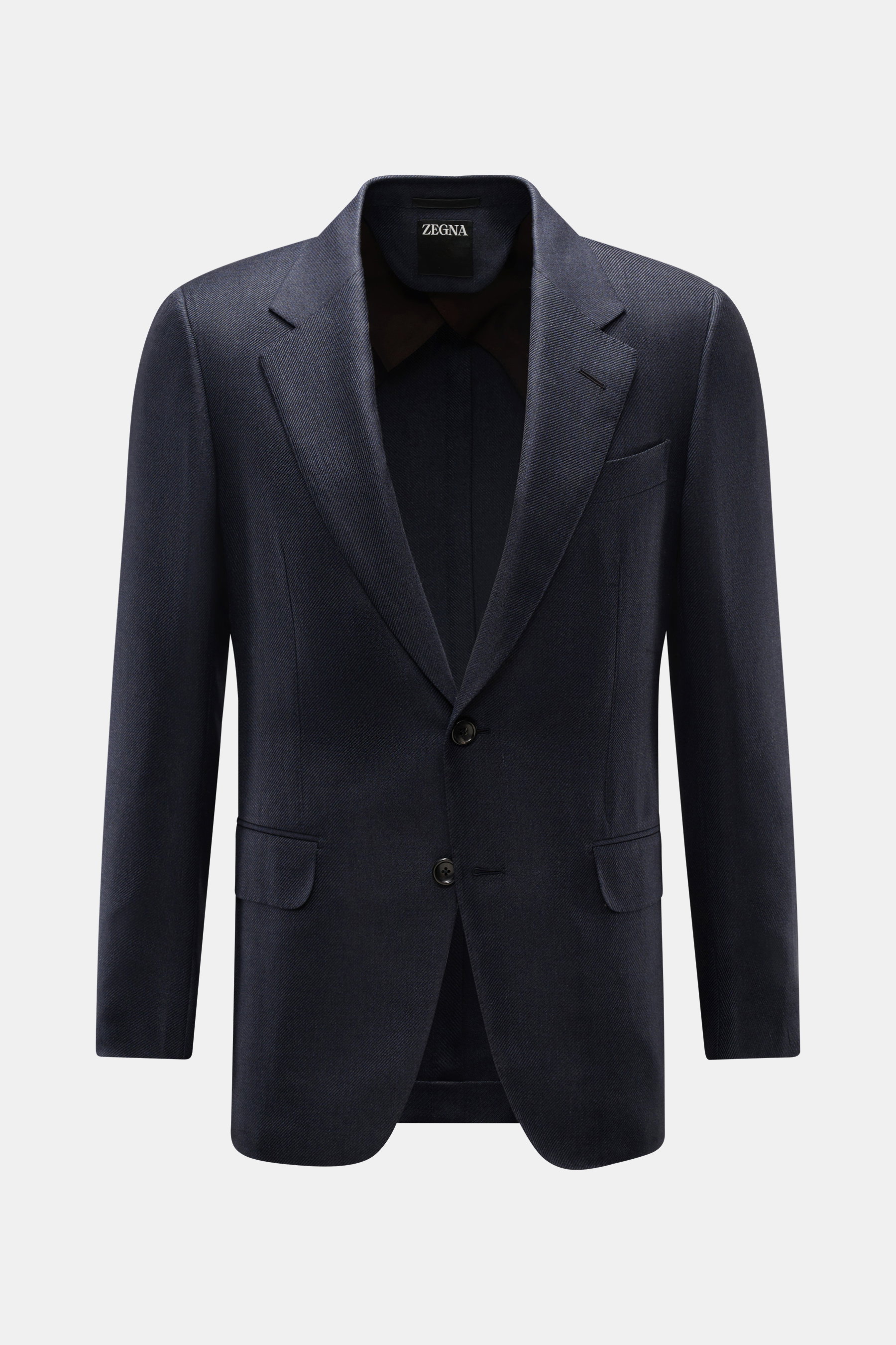 Front view of the Zegna Smart-casual jacket dark navy in cashmere, silk, and linen blend with a slim fit, two-button style, step lapel, breast pocket, flap hip pockets, unfinished cuffs, and side vents.

<p>The two-button smart-casual jacket by ZEGNA made