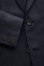 Close-up front view of the Zegna Smart-casual jacket dark navy showing two-button style, step lapel, and fine weave pattern.

<p>The two-button smart-casual jacket by ZEGNA made of cashmere and silk with linen content embodies Italian elegance and flawles
