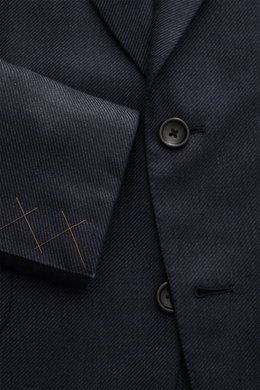Close-up front view of the Zegna Smart-casual jacket dark navy showing two-button style, step lapel, and fine weave pattern.

<p>The two-button smart-casual jacket by ZEGNA made of cashmere and silk with linen content embodies Italian elegance and flawles