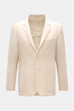 Frontale Nahaufnahme des cremefarbenen Percival Sakko 'Tailored Linen' aus leicht griffigem Leinen-Baumwoll-Mix mit Slim Fit, fallendem Revers, Brusttasche, aufgesetzten Hüfttaschen, Knopfärmeln, Seitenschlitzen und halbfütterung.