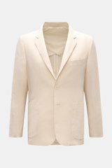 Frontale Nahaufnahme des cremefarbenen Percival Sakko 'Tailored Linen' aus leicht griffigem Leinen-Baumwoll-Mix mit Slim Fit, fallendem Revers, Brusttasche, aufgesetzten Hüfttaschen, Knopfärmeln, Seitenschlitzen und halbfütterung.