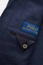 Close-up front view of Polo Ralph Lauren Sakko navy/schwarz kariert with Prince-of-Wales check, label, button, and pocket details.

<p>Setzen Sie ein Statement mit diesem edlen Sakko von POLO RALPH LAUREN: klassisches Prince-of-Wales Karo sowie Spitzrever