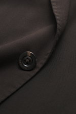 Close-up front view of Boglioli Blazer dark brown showing pure new wool fabric with soft touch, fine tonal herringbone, slim fit, tailored two-button style, notched lapel, classic breast pocket, patch hip pockets, kissing buttons, rear side vents, unconst
