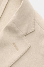 Close-up of Boglioli Beige Melange Knit Blazer showing the notched lapel and knit texture from a top-down angle.

Description: <p>Exquisite knit blazer by BOGLIOLI: Crafted from a luxurious silk-cashmere blend with a refined knit texture, this piece bring