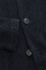 Close-up front view of the Emporio Armani Knitted blazer navy showing chenille microfiber fabric, slightly textured feel, draped lapel, five-button style, patch front pockets, regular fit, and unconstructed design.