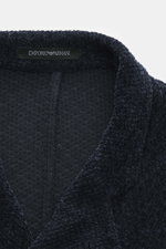 Close-up front view of the collar and label of the Emporio Armani Knitted blazer navy, featuring chenille microfiber, slightly textured feel, regular fit, draped lapel, five-button style, patch front pockets, and unconstructed design.