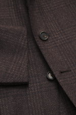 Close-up front view of Cesare Attolini Cashmere Blazer dark brown/black checkered showing buttons, notched lapel, breast and patch hip pockets.

Description: Treat yourself to luxury by CESARE ATTOLINI: This timeless blazer is exclusively made in Italy an
