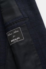 Close-up inside view of the Cesare Attolini Navy/Black Checked Blazer showing wool-cashmere mix, soft touch, classic Glencheck, slim fit, tailored three-button style, notched lapel, classic breast pocket, patch hip pockets, unfinished sleeve cuffs, rear s