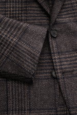 Close-up front view of the Cesare Attolini Cashmere Blazer taupe/dark brown checked showing buttons, notched lapel, and patch hip pocket in classic Glencheck pattern.  
<p>Indulge in luxury from CESARE ATTOLINI: This timeless blazer is exclusively made in
