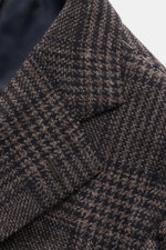 Close-up front view of Cesare Attolini Cashmere Blazer taupe/dark brown checked showing notched lapel, breast and patch hip pockets, and sleeve cuff details.

<p>Indulge in luxury from CESARE ATTOLINI: This timeless blazer is exclusively made in Italy and