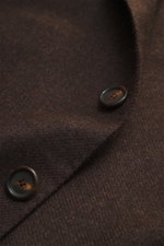 Close-up front view of the Cesare Attolini Cashmere Blazer Dark Brown Mélange showing fine texture, buttons, and rich fabric detail. Indulge in luxury from CESARE ATTOLINI: This timeless blazer is made in Italy from pure, finest cashmere – a masterpiece t