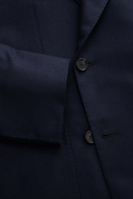 Close-up front view of the Cesare Attolini Cashmere Blazer navy, showcasing its double-breasted three-button style, notched lapel, and pure cashmere fabric with a very soft feel. Treat yourself to luxury with CESARE ATTOLINI: This double-breasted blazer w