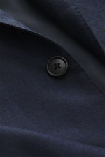 Close-up front view of the Belvest Cashmere blazer navy showing pure cashmere fabric with tonal herringbone weave, very soft feel, tailored two-button style, notched lapel with brand-typical pin, classic breast pocket, hip pockets with flap, unfinished sl