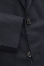 Close-up front view of the Belvest Cashmere Blazer navy showing pure cashmere fabric, soft feel, Slim Fit, tailored two-button style with notched lapel, brand-typical pin on lapel, classic breast pocket, hip pockets with flap, unfinished sleeve cuffs, rea