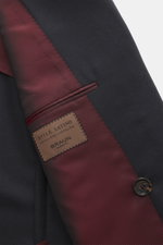 Close-up front view of the Stile Latino Cashmere Blazer 'Leo' navy showing smooth navy cashmere fabric, red striped inner lining, single button, and label. Experience tangible luxury with STILE LATINO's elegant 'Leo' blazer, crafted from a refined cashmer