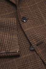 Close-up front view of Borrelli Blazer 'Procida' brown/dark brown checkered, a slim fit tailored three-button style with notched lapel, classic Glencheck pattern, slightly textured mix of wool and silk fabric, featuring classic breast pocket, patch hip po