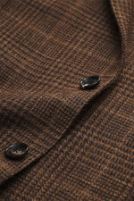 Close-up front detail of the Borrelli Blazer 'Procida' brown/dark brown checkered showing slim fit, wool and silk mix, slightly textured classic Glencheck fabric with black buttons.