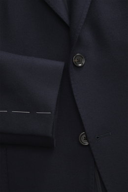 Close-up front view of Lardini Jersey Blazer navy showing slim fit, elastic virgin wool jersey, soft touch, tailored two-button style, notched lapel with flower pin, classic breast pocket, patch hip pockets, unfinished sleeve ends, rear side vents, uncons
