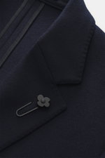 Close-up front detail of the Lardini Jersey Blazer navy, photographed from above, showing elastic virgin wool jersey, soft touch, slim fit, tailored two-button style, notched lapel with flower pin, classic breast pocket, patch hip pockets, unfinished slee