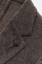Close-up top front view of Lardini Blazer grey-brown patterned showing mix of wool and microfiber, soft feel, subtle check pattern, Slim Fit, tailored two-button style, notched lapel with flower pin, classic breast pocket, patch hip pockets, unfinished sl
