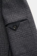 Lardini Blazer dark grey melange close-up from front side showing soft, airy woven wool, microfiber, cotton fabric with subtle Glencheck, patch hip pocket, unfinished sleeve cuff, and button detail, slim fit, fitted two-button style, notched lapel with fl