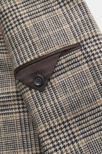 Close-up view of the sleeve cuff of the Lardini Blazer Beige/Dark Brown Checked, showing pure virgin wool with a soft touch, Glencheck woven pattern, slim fit, tailored two-button style, notched lapel with flower pin, classic breast pocket, patch hip pock