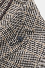 Close-up top-front view of Lardini Blazer Beige/Dark Brown Checked showing pure virgin wool, soft touch, Glencheck woven pattern, slim fit, tailored two-button style, notched lapel with flower pin, classic breast pocket, patch hip pockets, unfinished slee