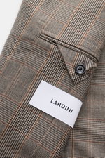 Close-up view of the Lardini Blazer Beige/Black Checked sleeve showing the Glencheck woven pattern, soft touch pure virgin wool fabric, slim fit, tailored two-button style, notched lapel with flower pin, classic breast pocket, patch hip pockets, unfinishe
