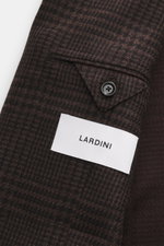 Close-up top view of the Lardini Brown/Dark Brown Checked Blazer sleeve showing glencheck pattern, button, and label.

Description: <p>Autumnally elegant: This blazer with a woven pattern by LARDINI made of a noble wool-cashmere blend gives your appearanc