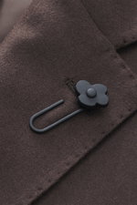 Close-up front view of Lardini Brown Jersey Blazer showing notched lapel with flower pin, jersey made of pure virgin wool, soft touch, slim fit, tailored two-button style, classic breast pocket, hip pockets with flap, sleeve cuffs unfinished, rear side ve