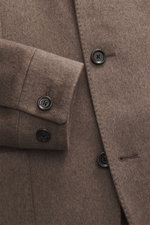 Close-up front view of Lardini Cashmere blazer grey brown showing buttoned sleeve cuffs and tailored four-button style, pure cashmere, soft touch, slim fit, stand-up collar with tab, patch hip pockets, center back vent, unconstructed design, two inner poc