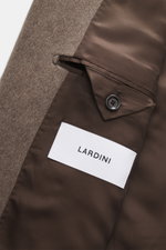 Close-up inside view of Lardini Cashmere blazer grey brown showing pure cashmere fabric, soft touch, tailored four-button style, buttoned sleeve cuffs, unconstructed design, patch hip pockets, stand-up collar with tab, center back vent, slim fit, and two 