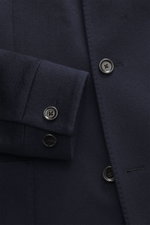 Close-up front view of the Lardini Cashmere blazer navy, showcasing pure cashmere fabric, soft touch, slim fit, tailored four-button style, buttoned sleeve cuffs, stand-up collar with tab, patch hip pockets, center back vent, unconstructed design, and two