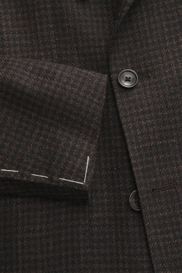 Close-up front side view of Tagliatore Blazer dark brown/black checkered showcasing double-breasted three-button style, peaked lapel, classic breast pocket, and soft virgin wool-silk blend with subtle houndstooth pattern, unfinished sleeve ends, and visib
