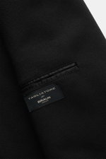Close-up view of the Tagliatore Black Blazer showcasing its pure new wool fabric with a slightly textured, woven structure and interior pocket.

<p>The double-breasted blazer by TAGLIATORE made of pure new wool combines Italian tailoring craftsmanship wit