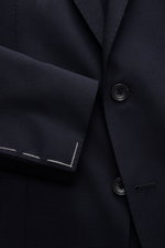 Close-up front view of Tagliatore Cashmere Sakko 'Monte Carlo' navy, showcasing slim fit, unconstructed design, two-button closure, soft pure cashmere fabric, and tailored lapel with brand pin.
