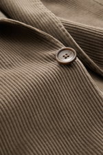 Close-up front view of the Tagliatore Cord Blazer taupe showing soft cotton-wool corduroy, a brown button, and detailed stitching.