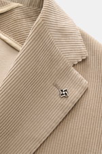 Close-up front view of Tagliatore Cord Blazer beige showing soft cotton-wool corduroy, notched lapel, and brand pin detail.

Description: <p>The unconstructed design made from soft cord makes this blazer by TAGLIATORE an exclusive companion for the office