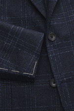 Tagliatore Blazer navy/black checked close-up front view showing slim fit tailored two-button style with notched lapel, virgin wool and microfiber mix, Prince of Wales pattern, soft feel, classic breast pocket, patch hip pockets, rear side vents, unconstr