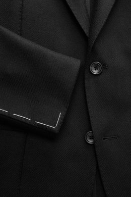 Close-up front view of the Tagliatore Black Blazer showing fine wool-cashmere fabric, tailored two-button slim fit, notched lapel, and soft texture.