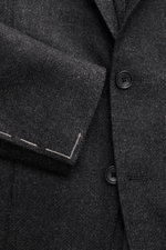 Close-up front view of Tagliatore Dark Grey Melange Blazer showing soft wool with cashmere, buttons, and tailored two-button style.

Description: <p>The unconstructed craftsmanship made from fine wool with cashmere makes this blazer by TAGLIATORE an exclu