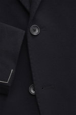 Close-up front view of the Tagliatore Cashmere Blazer dark navy, highlighting the soft pure cashmere fabric, single button, and unconstructed craftsmanship. The lightweight blazer features a slim fit, tailored two-button style, notched lapel with brand-ty