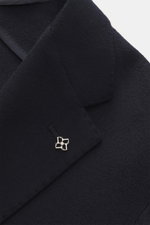 Close-up front angle of Tagliatore Cashmere Blazer dark navy showcasing pure cashmere fabric, notched lapel with brand pin, slim fit, soft touch, tailored two-button style, classic breast pocket, welted ticket pocket, hip pockets with flap, unfinished sle