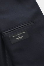 Close-up image of the Tagliatore Navy Blazer interior pocket, photographed from above, showing wool with cashmere content, soft touch, slim fit, tailored two-button style, notched lapel, brand-typical pin on the lapel, classic breast pocket, patch hip poc