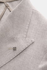 Close-up front-left side view of Tagliatore Taupe Melange Blazer showcasing peaked lapel, signature pin, and soft virgin wool-cashmere blend fabric.