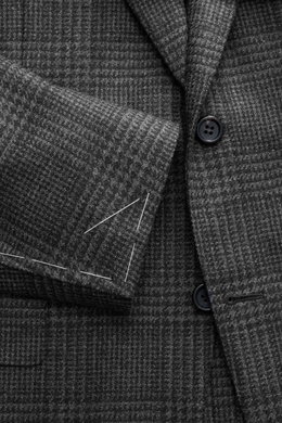 Close-up front view of Canali Blazer Dark Grey/Grey Checked showing pure wool fabric with Prince-of-Wales pattern, soft touch, slim fit, tailored two-button style, notched lapel, classic breast pocket, hip pockets with flap, unfinished sleeve cuffs, rear 