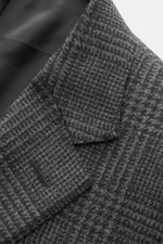 Close-up front side view of Canali Blazer Dark Grey/Grey Checked showing prince-of-Wales pattern, pure wool, soft touch, slim fit, tailored two-button style, notched lapel, classic breast pocket, hip pockets with flap, unfinished sleeve cuffs, rear side v